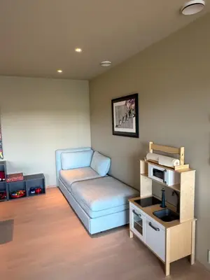 a small room with a couch and a table at Colorful family apartment near the sea - boat for rent