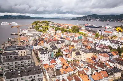 an aerial view of a city next to the water at Bergen pearl in historic street & easy check-in in Bergen