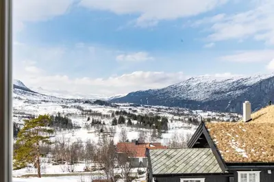 a view of a snowy mountain from a house at The national park is calling! in Garden
