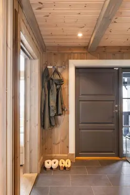 a door in a room with a wooden wall at The national park is calling! in Garden