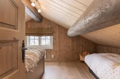 a bedroom with a bed and a wooden ceiling at The national park is calling! in Garden