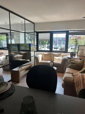 a living room with couches and tables and windows at Holiday apartment south Norway in Lii