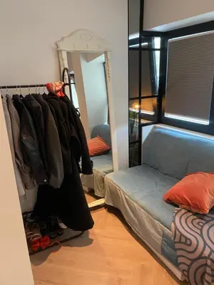 a bedroom with a bunk bed and a mirror at Holiday apartment south Norway in Lii