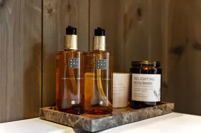 three bottles of essential oils sitting on a shelf at Trysilfjell 720 by Vacation Trysil in Trysil