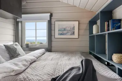 a bedroom with a large bed and a window at Cozy Skilodge ski in & out in Trysil in Trysil