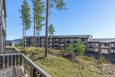 a balcony of an apartment building with trees at Trysilfjell 24 by Vacation Trysil in Trysil