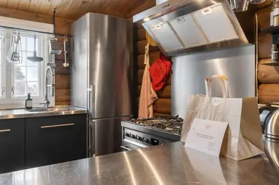 a kitchen with a stainless steel stove and a counter at Trysilfjell 636 by Vacation Trysil in Trysil