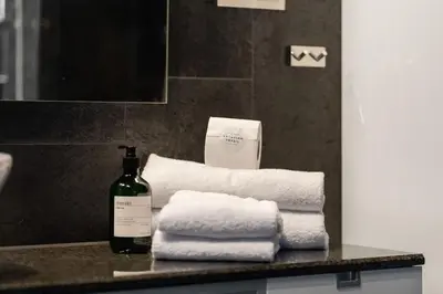 a bottle of wine sitting on a counter with towels at Trysilfjell 636 by Vacation Trysil in Trysil
