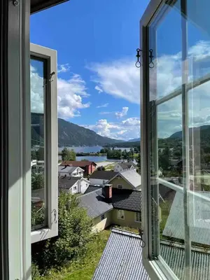 a view of a city from a window at Trivelig lite hus in Lii