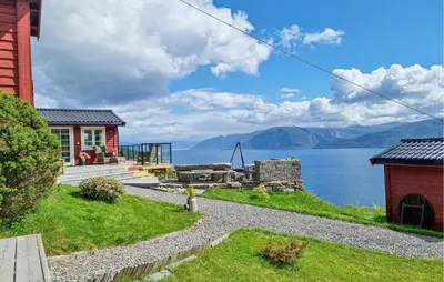 a house with a view of the water at Stunning Home In Lavik in Lavik