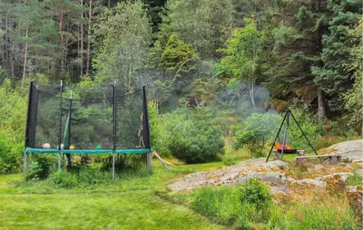 a batting cage with balls on it in a field at 3 Bedroom Gorgeous Home In Kolbeinsvik in Kolbeinsvik