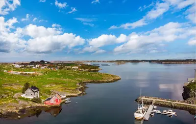 an island in a body of water with a boat at Amazing Home In Rong With Ethernet Internet in Rong