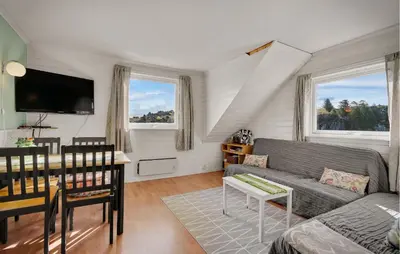 a living room with a couch and a table at Amazing Home In Rong With Ethernet Internet in Rong