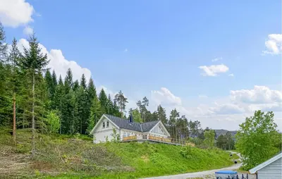 a house on a hill in the woods at Pet Friendly Home In Eidsvåg I Romsdal in Eidsvåg