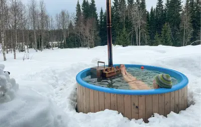 a hot tub in a snow covered field at Awesome Home In Trysil With Sauna in Trysil