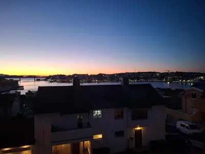 a view of the sunset from a building at KSU Topleiligheten in Kristiansund