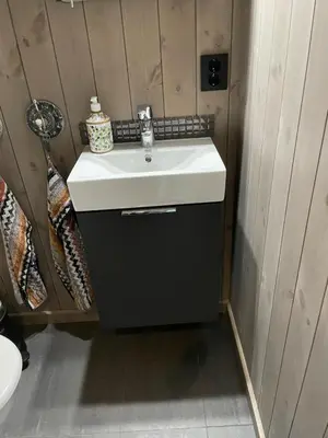 a bathroom with a white sink in a room at MYLLA - New cabin - Sauna - Hike - Bike - Canoe- Fishing in Jevnaker