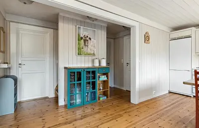 a living room with a blue cabinet in a room at Cabin with ski in-out in Sør-Fron