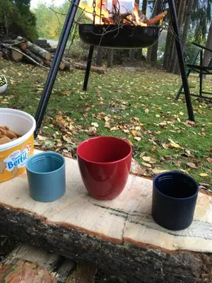 four bowls sitting on a cutting board next to a fire at Welcome to Dalborg, only 1,5 hours from Oslo