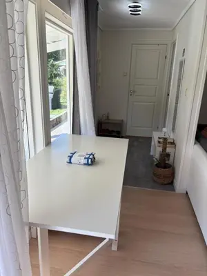 a white table in a room with a window at Apartment in Bergen in Bergen