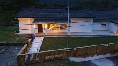 a house with a wooden fence in front of it at Apartment in Bergen in Bergen