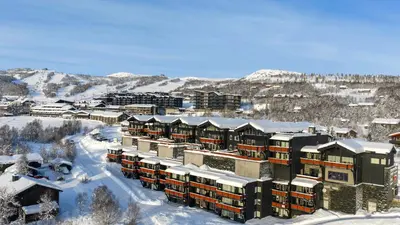 arial view of a resort in the snow at Toppleilighet Midt I Beitostølen in Beitostøl