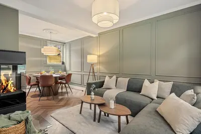 a living room with a couch and a table at The Townhouse Dream I No Expense Spared I NEW 2025 in Bergen