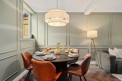 a dining room with a table and chairs at The Townhouse Dream I No Expense Spared I NEW 2025 in Bergen