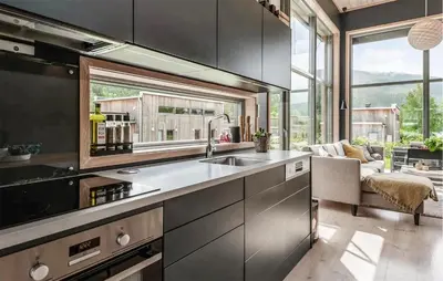 a kitchen with a sink and a living room at Lovely Home In Ål With House Sea View in Ål