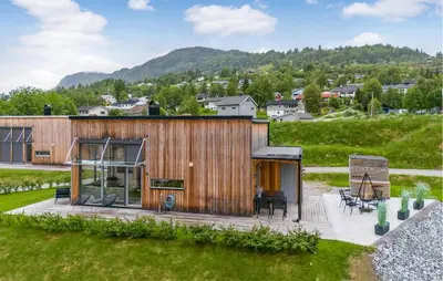 a wooden house with a view of a mountain at Lovely Home In Ål With House Sea View in Ål