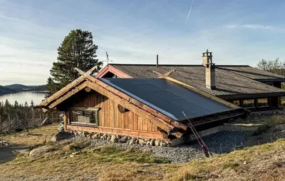 a house with a solar roof on a hill at Amazing Home In Tunhovd With Sauna in Tunhovd