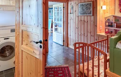 a laundry room with a washer and dryer in a house at Amazing Home In Tunhovd With Sauna in Tunhovd