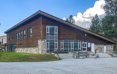 a large brick building with a large window at Amazing Apartment In Bjorli With Sauna in Bjorli