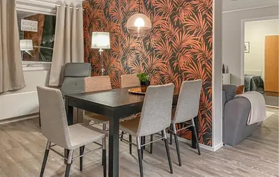 a dining room with a table and chairs at Amazing Apartment In Bjorli With Sauna in Bjorli
