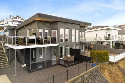 an image of a house with a balcony at Semi-detached house with lovely views of the city fjord in Askøy