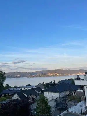 a view of a town with a lake and houses at Semi-detached house with lovely views of the city fjord in Askøy