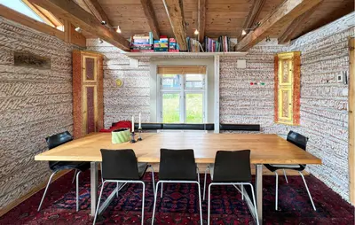 a conference room with a wooden table and chairs at Beautiful Home In Røn With Sauna in Ron