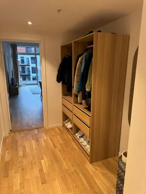 a room with a closet with shoes in it at Oceanfront Stay, Large Balcony and Rooftop Access in Bergen