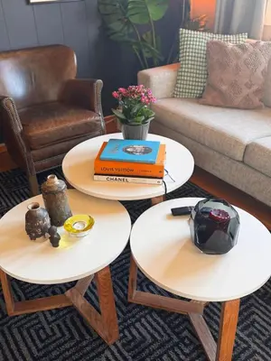 two tables in a living room with a couch at Kikays Hygge in Bysheim