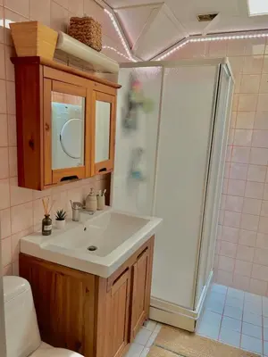 a bathroom with a sink and a shower at Studio in Os Near Bergen
