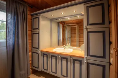 a bathroom with a sink and a mirror at Trysilfjellet Sør 802 in Trysil
