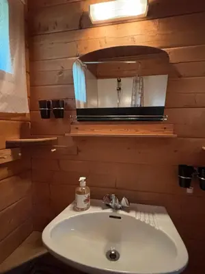 a bathroom with a sink and a mirror at Geilo - Hyggelig og sentral hytte in Hol
