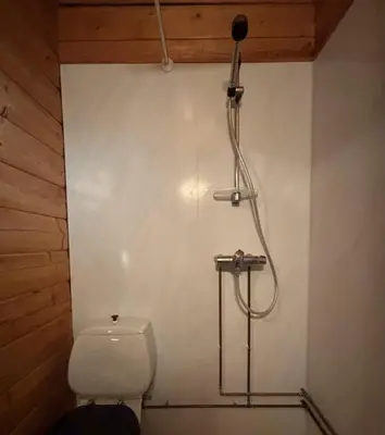 a shower in a bathroom with a toilet at Geilo - Hyggelig og sentral hytte in Hol