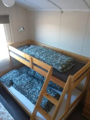 two bunk beds sitting in a room with at Gullingen Cabin Winter Wonderland