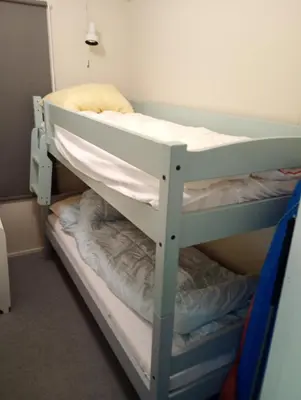 a bunk bed in a small room with a bunk bedscribed at Gullingen Cabin Winter Wonderland