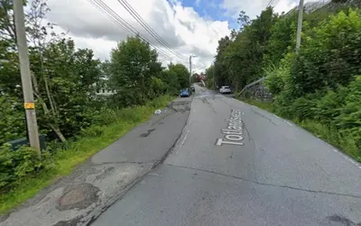 an empty road with the words stop written on it at Moderne leilighet in Bergen