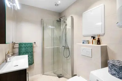 a bathroom with a shower and a sink at Inviting & Cozy City Apartment in Bergen