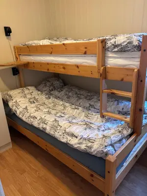 a couple of bunk beds in a room at Apartment vårstølen in Vossevangen
