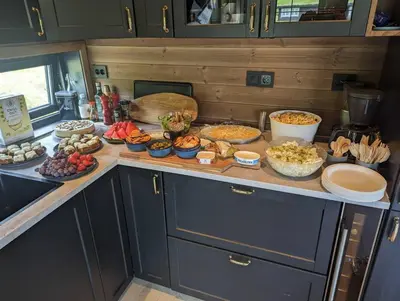 a kitchen counter with many different types of food on it at 2 cabins surrounded by beautiful nature in Stryn