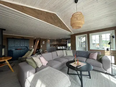 a living room with a couch and a table at Annebu by Norgesbooking - cabin at 1000 meter with amazing view in Ål